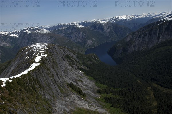 USA, Alaska, Misty Fjords Nat. Monument, Aerial view over mountain range with scattering of snow on highest peaks