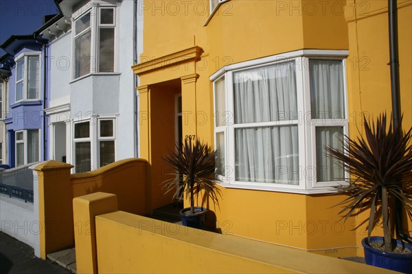 ENGLAND, East Sussex, Brighton, Brightly coloured terraced houses in Hanover area