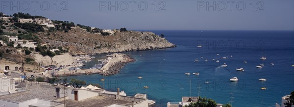 ITALY, Puglia, The village of Castro Marina on the South Adriatic Sea coast. Boats at sea and in the harbour.