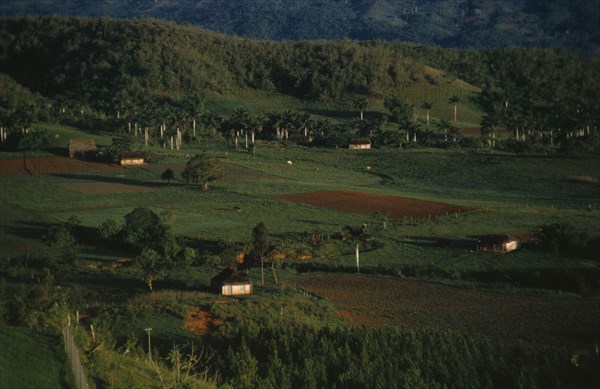 CUBA, Pinar del Rio, Green Farmland and farm buildings