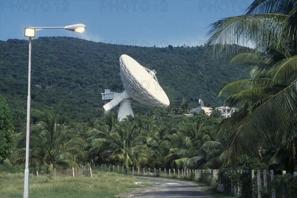 JAMAICA, Media, Satelite earth station.  Satelite dish above palm trees.