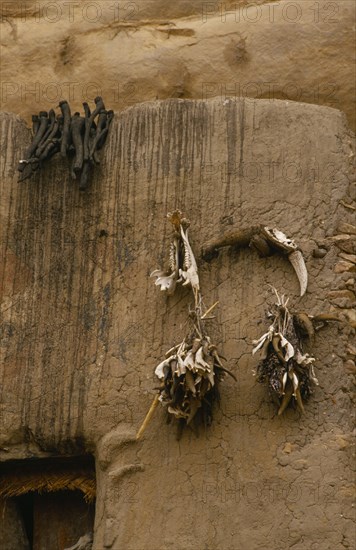 MALI, Bandiagara Escarpment, Fetishes adorning Dogon grannary exterior wall.