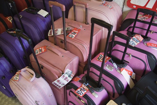 ENGLAND, East Sussex, Brighton, High street luggage shop interior with cases on sale