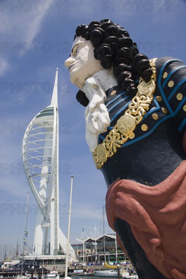 ENGLAND, Hampshire, Portsmouth, The Spinnaker Tower the tallest public viewing platforn in the UK at 170 metres on Gunwharf Quay with old ships bowspit figurehead in the foreground