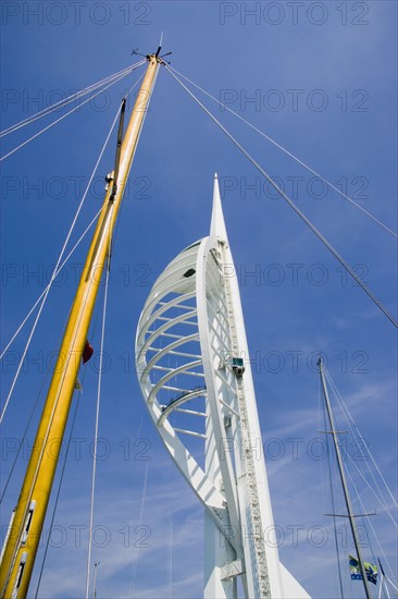 ENGLAND, Hampshire, Portsmouth, The Spinnaker Tower the tallest public viewing platforn in the UK at 170 metres on Gunwharf Quay with a yachts mast in the foreground