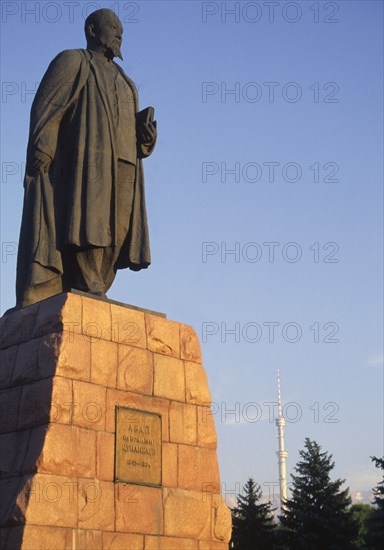 KAZAKHSTAN, Almaty, "Statue of Lenin, with telecommunications tower in background."