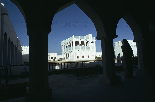 QATAR, Doha, Doha Museum with visitors walking through arches