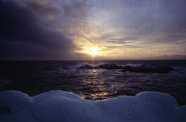 NORWAY, Honningsvag, Coastal view with the wintersun..