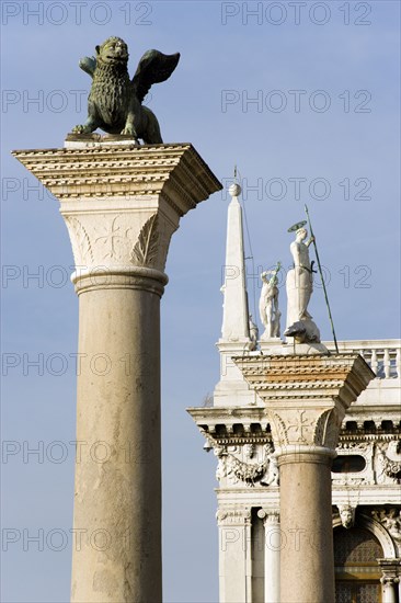ITALY, Veneto, Venice, The winged Lion of Saint Mark on the Column San Marco with the Column of San Teodoro beyond in the Piazzatta