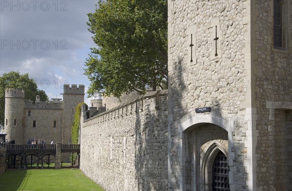 ENGLAND, London, The Tower of London showing moat and battlements.