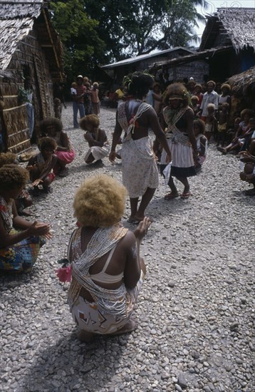 PACIFIC ISLANDS, Melanesia, Solomon Islands, "Malaita Province, Lau Lagoon, Foueda Island.  Dance performed to celebrate forthcoming wedding.  Girls wearing multi-strand shell and coral neacklaces. "