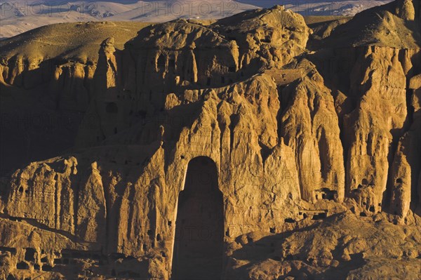 AFGHANISTAN, Bamiyan Province, Bamiyan, View of Bamiyan valley showing cliffs with empty niche where the famous carved Budda once stood (destroyed by the Taliban in 2001)
