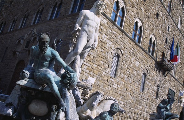 ITALY, Tuscany, Florence, Piazza della Signoria. Palazzo Vecchio behind The Fountain of Neptune