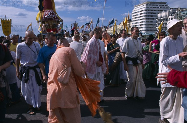 ENGLAND, East Sussex, Brighton, Hare Krishna taking part in a parade on Brighton seafront