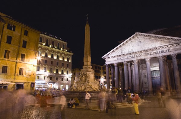 ITALY, Lazio, Rome, Tourists at night in the illuminated Piazza della Rotunda with the Fountain in the centre and the Pantheon on the right