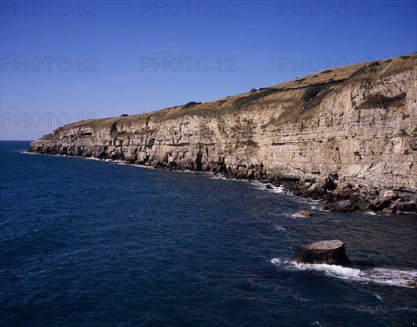 ENGLAND, Dorset, Jurassic Coastline, View west from Seacombe Quarry across the sea towards Winspit Quarry
