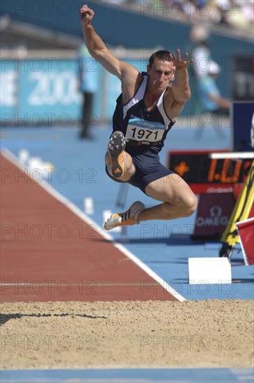 SPORT, Athletics, Long Jump, "Scotland's Darren Ritchie during the long Jump in mid leap. 2006 Commonwealth Games Melbourne, Australia."