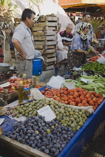 Kusadasi, Aydin Province, Turkey. Stall at weekly market selling fresh fruit and vegetables in brightly coloured display. Asian Colored Destination Destinations European Middle East South Eastern Europe Turkish Turkiye Western Asia