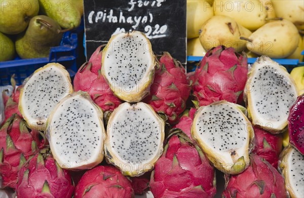 Vienna, Austria. The Naschmarkt. Exotic fruit for sale on market stall. Genus Hylocereus sweet pitayas commonly known as dragon fruit. Austria Austrian Republic Vienna Viennese Wien Europe European City Capital Naschmarkt Market Display Fresh Food Fruit Stall Shop Store Dragon Color Destination Destinations Osterreich Viena Western Europe