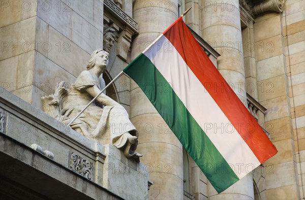 Budapest, Pest County, Hungary. Hungarian flag flying from building facade. Hungary Hungarian Europe European East Eastern Buda Pest Budapest City Architecture Facade Details Flag Tricolor Tricolour Red White Green Destination Destinations Eastern Europe