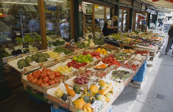 Vienna, Austria. The Naschmarkt. Display of fresh fruit and vegetables for sale outside shopfront. Austria Austrian Republic Vienna Viennese Wien Europe European City Capital Naschmarkt Market Display Stall Store Shop Fruit Veg Vegetable Vegetables Fresh Food Destination Destinations Osterreich Viena Western Europe