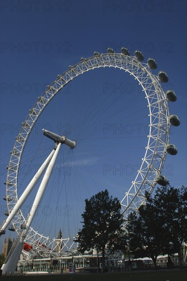 England, London, British Airways London Eye against blue sky