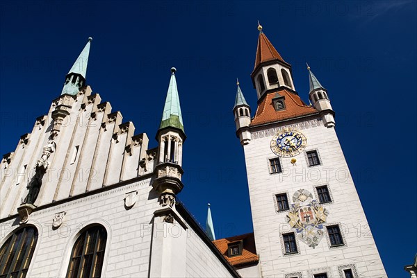 Marienplatz. Altes Rathaus or Old Town Hall. Original building dating from the fifteenth century with baroque facade added in the seventeenth century. Angled detail of facade and clock tower. Photo : Hugh Rooney