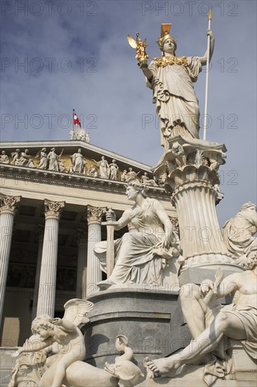Statue of Athena raised on pillar above fountain in front of the Parliament building. Photo : Bennett Dean