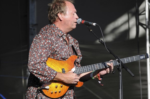 Music, Strings, Guitars, Mark King bass player with Level 42 playing at Guilfest 2010. . 
Photo Bob Battersby